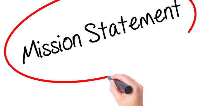 Women Hand writing Mission Statement with black marker on visual screen. Isolated on white. Business, technology, internet concept. Stock Photo