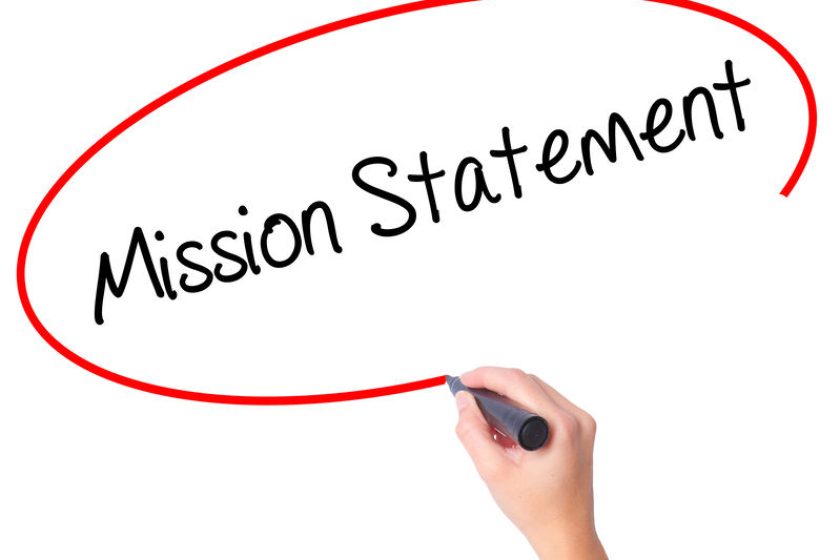 Women Hand writing Mission Statement with black marker on visual screen. Isolated on white. Business, technology, internet concept. Stock Photo