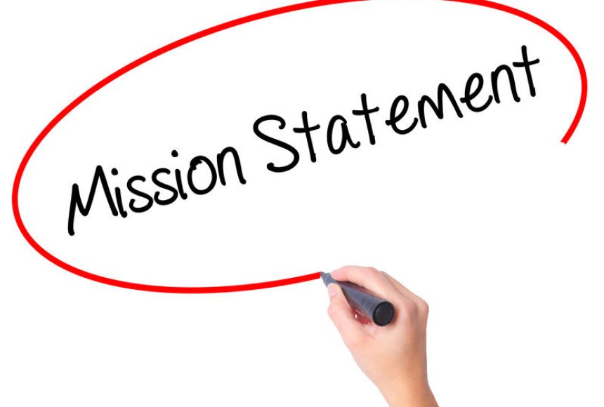 Women Hand writing Mission Statement with black marker on visual screen. Isolated on white. Business, technology, internet concept. Stock Photo